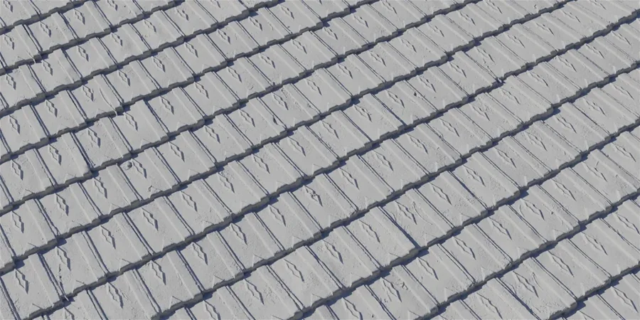 Rows of grey concrete roof tiles